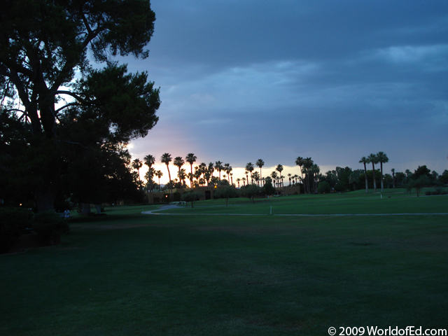Sunset over the golf course green.