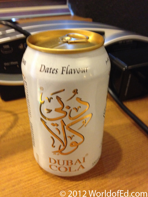 A can of Date flavored soda on a hotel desk.