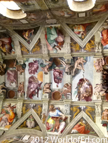 A picture of The Creation by Michaelangelo inside the Sistine Chapel.